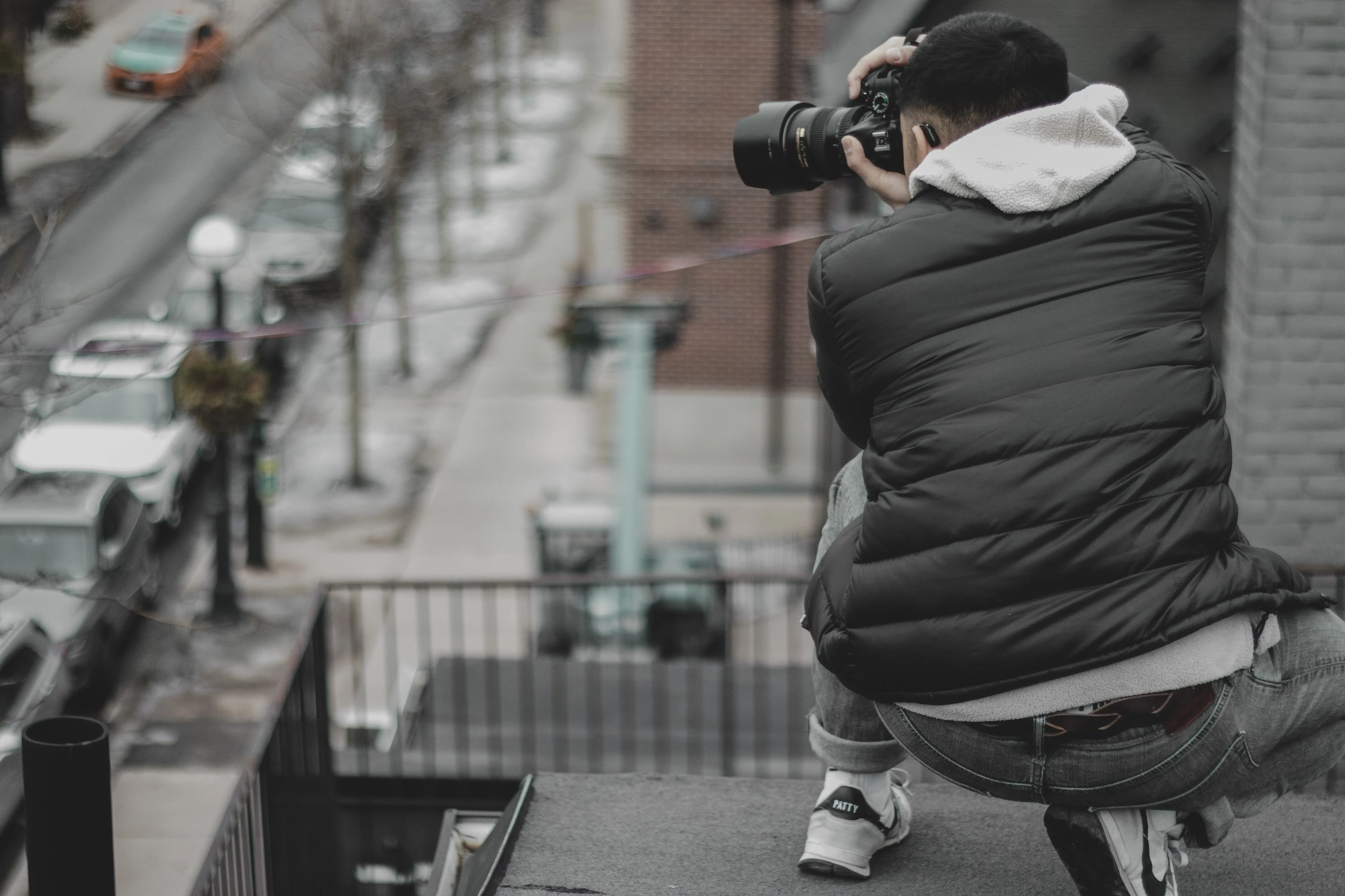 Enthusiast taking photos of cars